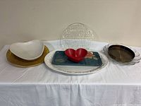 All eight pieces lined on table