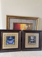 Group shot of three framed prints showing sizes and frame finishes