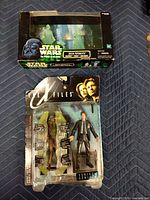 Star Wars Jedi Spirits box and X-Files Mulder blister pack front view