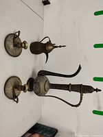 Group shot of both ewers and two chambersticks