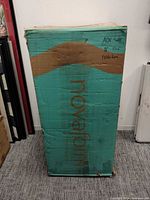 Front of teal Novaform box, visible dents and tears