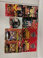 All eight blister-packed die-cast cars laid out