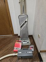 Upright vacuum, portable vacuum, filter bags, belt displayed