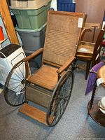 Full view of antique wooden wheelchair