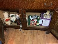 Overview of cabinet showing loose warmers and two boxed warmers