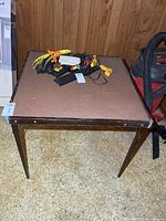 Full view of card table top with items resting on it