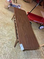 Top view showing rectangular wooden surface and overall shape