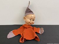 Front view of Dopey puppet showing head, body, hat and arm condition