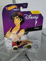 Front view of sealed Hot Wheels Disney Aladdin character car on card