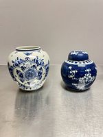 Front view of both Delft ginger jars