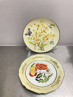 Front view of both porcelain plates displaying designs