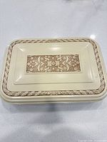 Closed cream storage chest with floral decoration