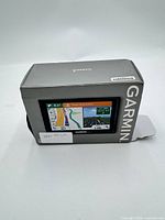 Garmin Drive 51 GPS displayed in front of original box