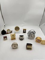 Group shot of all clocks laid out showing variety and quantity
