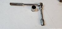 Ratchet, deep socket fitted, separate standard socket
