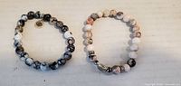 both beaded stretch bracelets side by side
