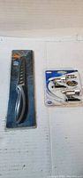 Ozark Trail fillet knife and Deer Alert whistles in unopened retail packages