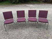 Front view of four burgundy chrome chairs side by side