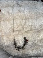 Full view of silver snake chain necklace laid flat