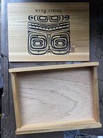 Box open with lid showing Spirit Bear artwork