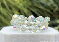 Bracelet front view showing three rows of clear AB faceted beads