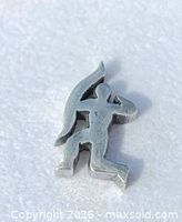 Front view of sterling silver archer pendant on white background