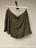 Front view of olive green Frank And Oak shorts