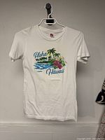 Front view of white T-shirt showing graphic and text