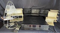 All items arranged: CD player, remote, metal stand, six plastic racks