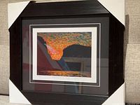 Full view of framed lithograph with protective covers