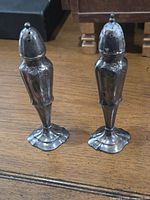 Front view of both shakers standing upright