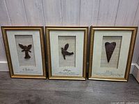All three framed inspirational art pieces side by side