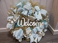 Front view of wreath showing colors, materials and Welcome sign