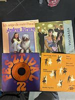 Front view of four 7-inch singles with sleeves visible