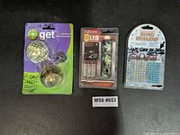 All three packaged items: Get mirror ball light, i-Zoom flashlight with batteries, Bling Brilliant rhinestone stickers