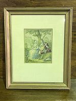 Front view of framed print showing matting and gilt wood frame