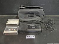 Full lot with recorder, two tapes, AC adapter, carrying case