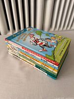 Stack of eight Dr. Seuss books showing spines