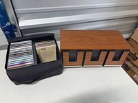 Closed soft case beside wood-grain four-drawer box