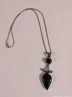 Full view of necklace showing chain and pendant