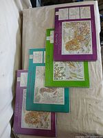 Top view of four spiral coloring books staggered