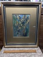 Full view of framed artwork with ruler for scale