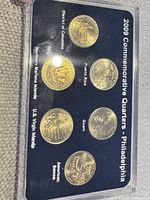 Full view of six-coin set in plastic holder