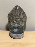 Front view showing walrus engraving and tealight recess