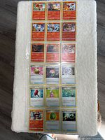 All 18 cards laid out, showing both Pokémon and Trainer cards