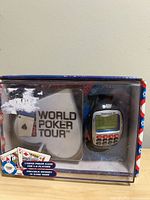 Front view of boxed World Poker Tour Texas Hold 'Em game watch and coaster