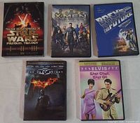 Five DVD cases laid out
