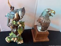 Both bird sculptures side by side for scale and comparison