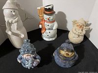 Group shot of five figurines