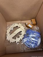 wood wreath, grad signs, two small tan boxes